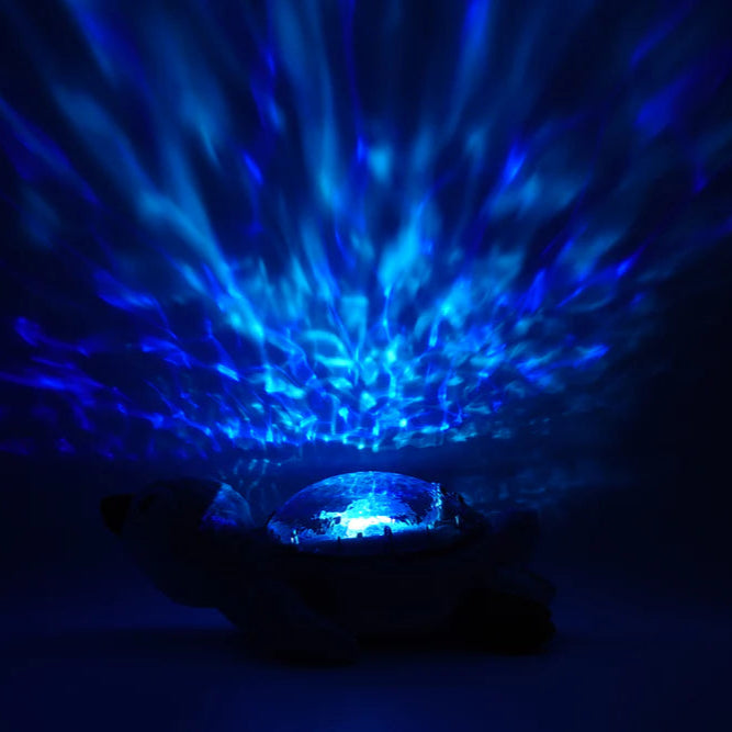 Proyector de Luz y Sonido Cloud b Tranquil Penguin™ – Recargable y Eco-Friendly