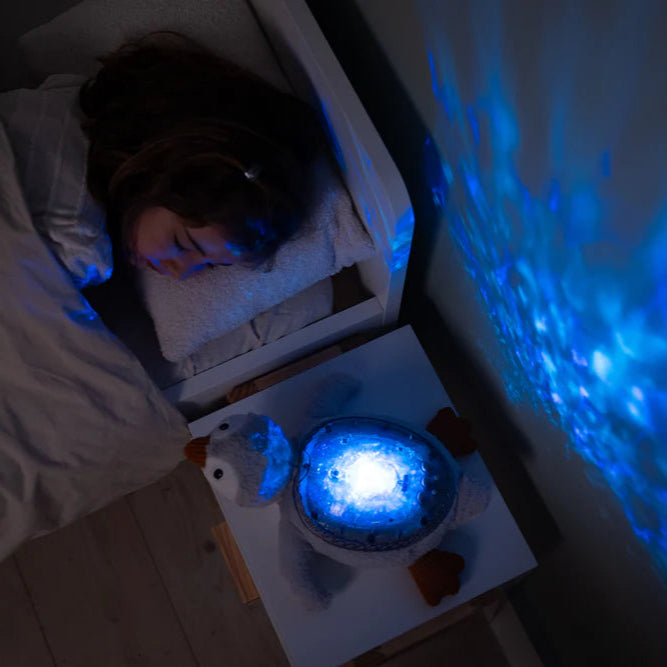 Proyector de Luz y Sonido Cloud b Tranquil Penguin™ – Recargable y Eco-Friendly