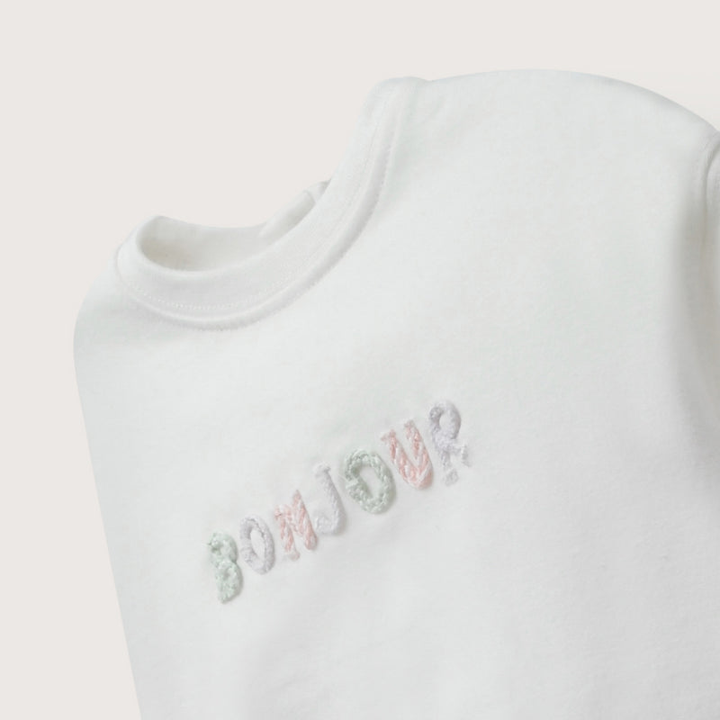 Polerón blanco de bebé niña