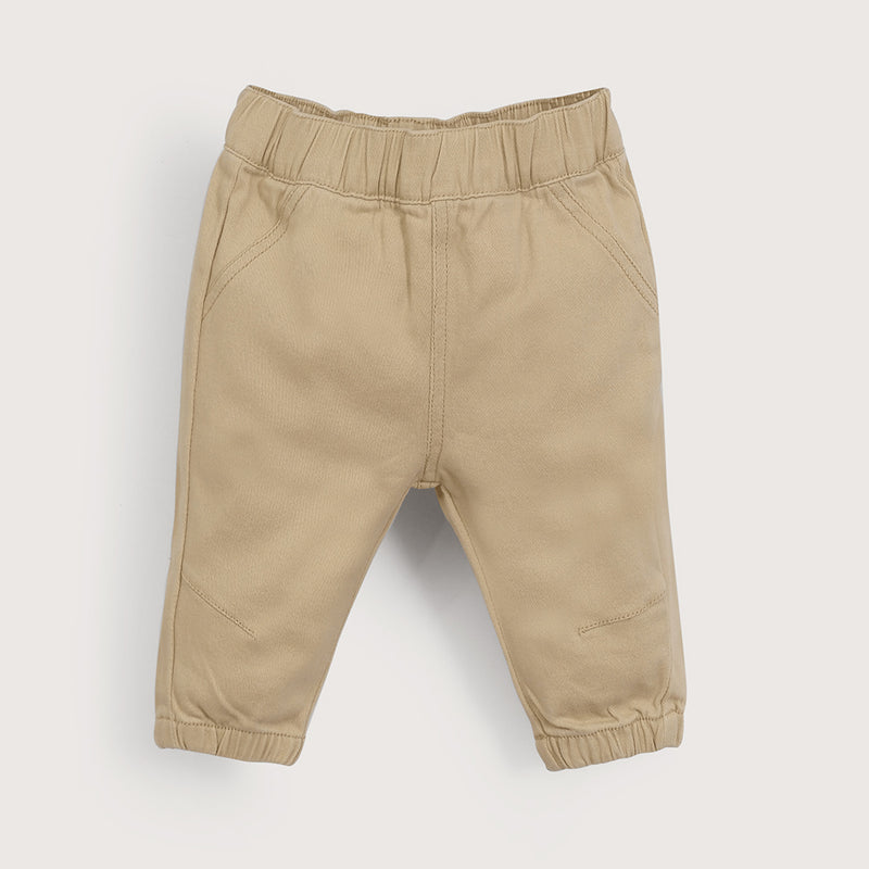 Pantalón beige de bebé niño
