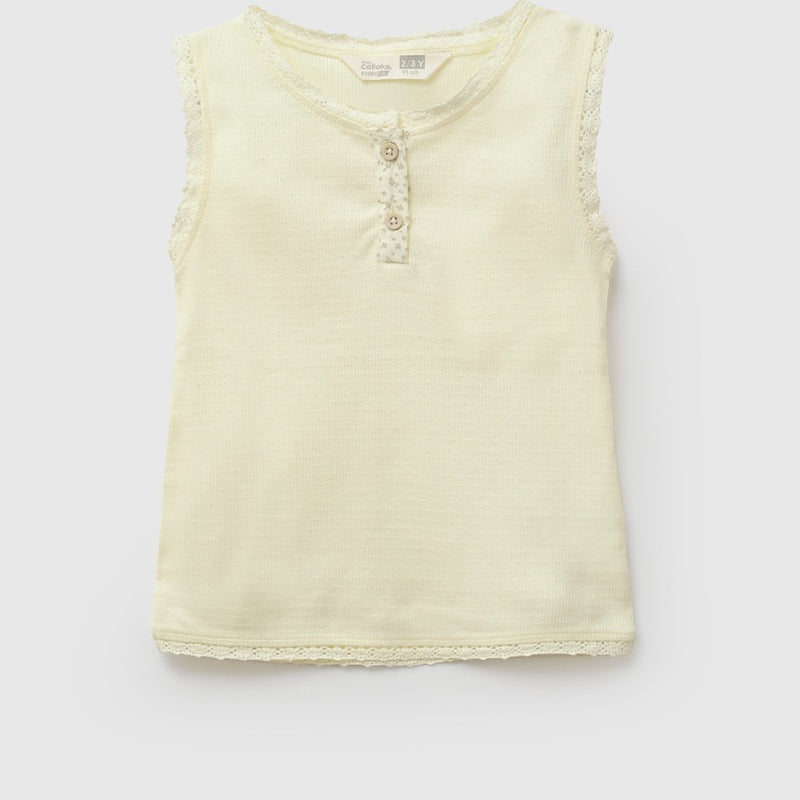 Polera sin mangas niña amarillo 6-9M a 4-5A